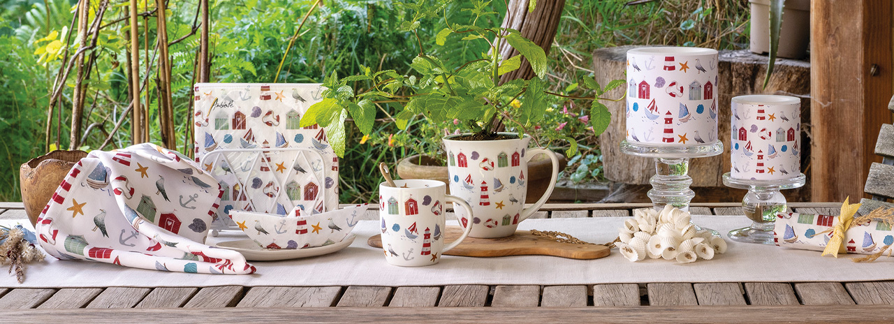 Summer table setting using the Nautical Items napkins and accessories in classic blue, red, and white tones.