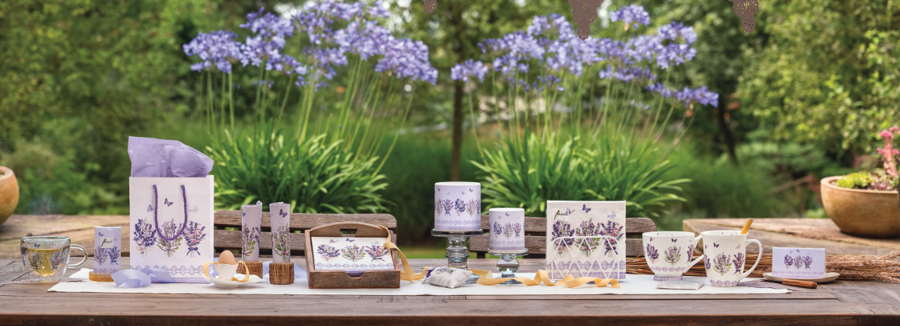 Full summer table setting featuring Lovely Lavender napkins, table runner, and matching lilac accessories.