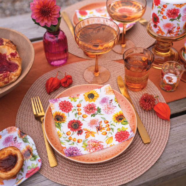 2 sizes FSC paper napkins Autumn blooming with colourful floral print, outdoor setting with candle and flowers